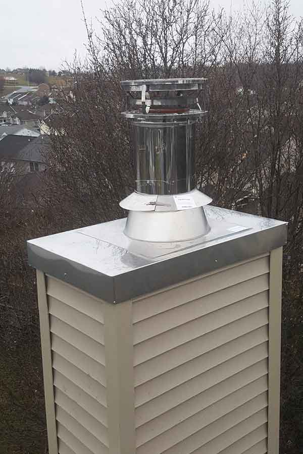 Chimney Guys VA original photo Stainless Steel Chase Cover and Cap Stainless Steel Chase Cover and Cap homes in the background