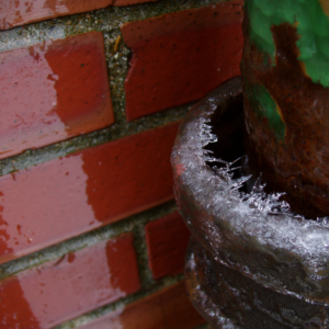 red brickwork covered by water and ice