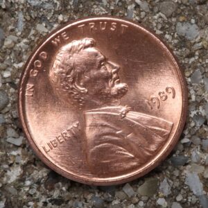 a penny laying on the ground heads up